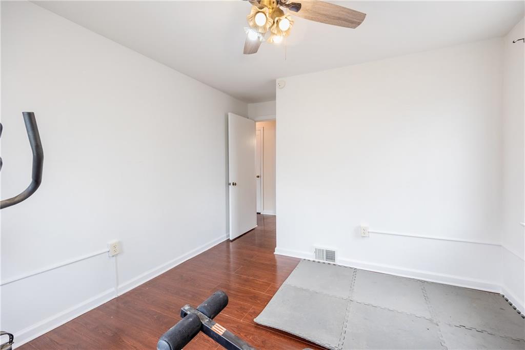 3958 Monroeville Boulevard Monroeville, PA 15146 - Photo 12 of 29 an empty room with wooden floor and windows