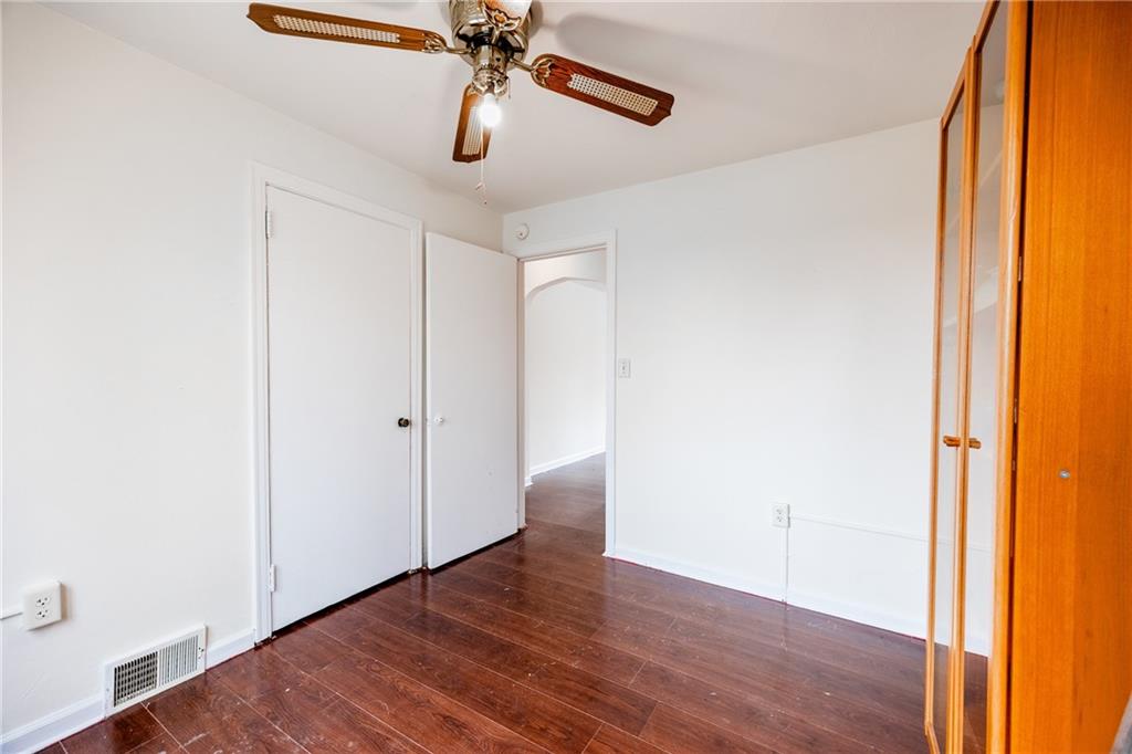 3958 Monroeville Boulevard Monroeville, PA 15146 - Photo 16 of 29 an empty room with wooden floor closet and windows