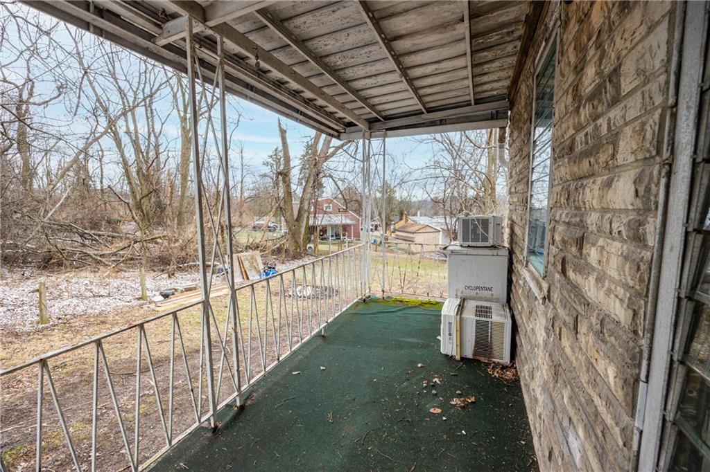 3958 Monroeville Boulevard Monroeville, PA 15146 - Photo 3 of 29 a view of a porch with wooden floor and roof