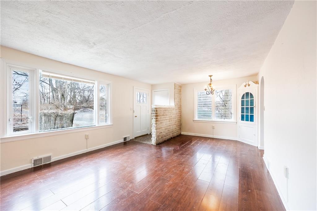 3958 Monroeville Boulevard Monroeville, PA 15146 - Photo 5 of 29 an empty room with wooden floor and windows