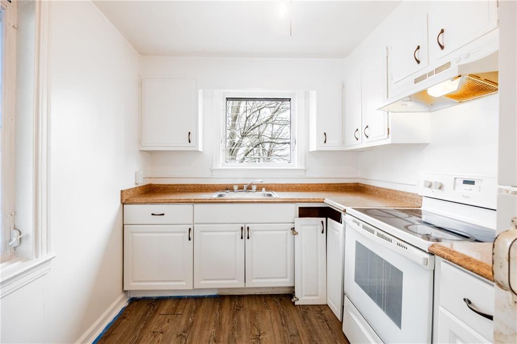 3958 Monroeville Boulevard Monroeville, PA 15146 - Photo 7 of 29 a kitchen with granite countertop white cabinets and white appliances