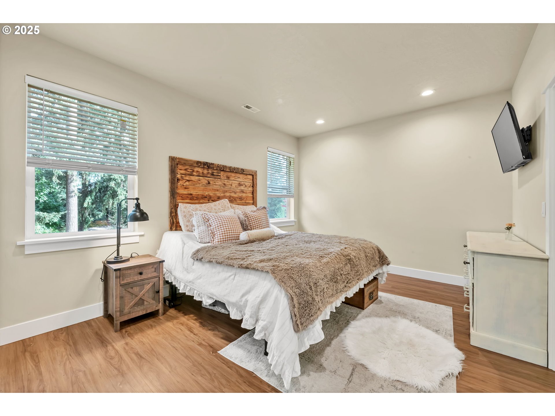 24701 Nottingham Street Veneta, OR 97487 - Photo 11 of 28 a spacious bedroom with a bed and a large window
