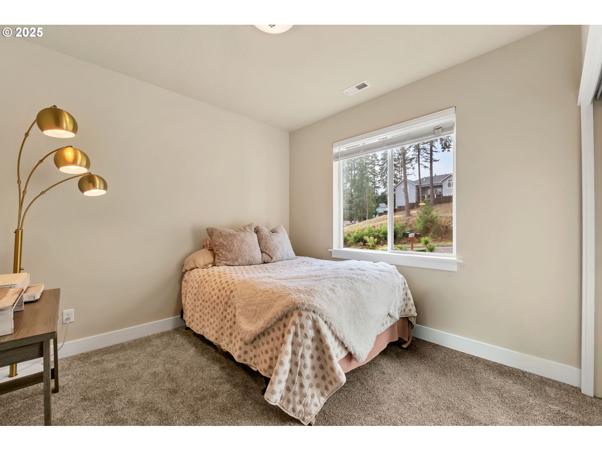 24701 Nottingham Street Veneta, OR 97487 - Photo 15 of 28 a bedroom with a bed and a window