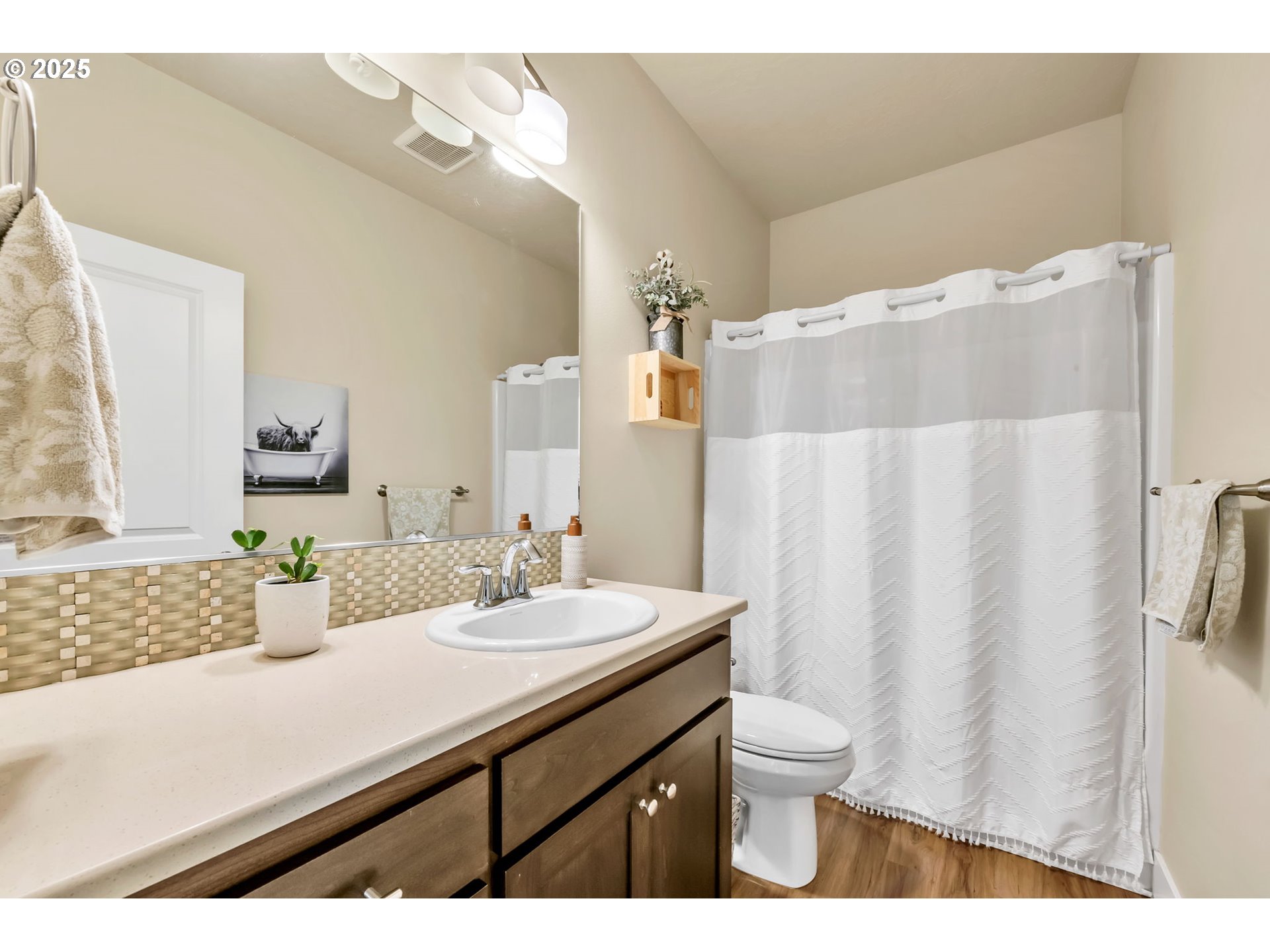 24701 Nottingham Street Veneta, OR 97487 - Photo 16 of 28 a bathroom with a sink a toilet and a mirror