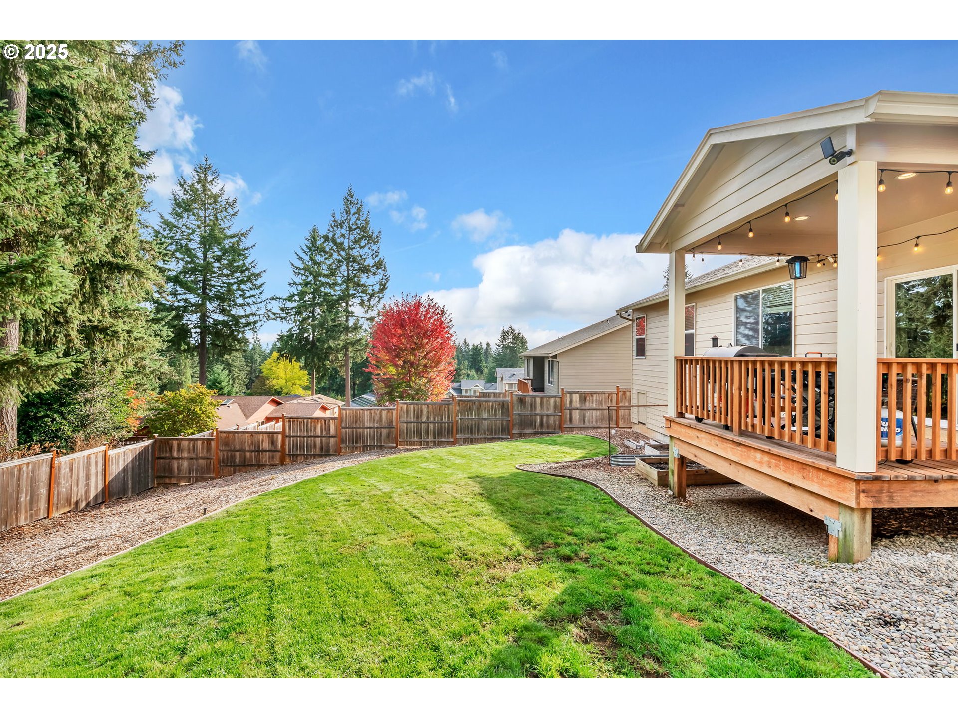24701 Nottingham Street Veneta, OR 97487 - Photo 22 of 28 a view of a house with a yard and a deck