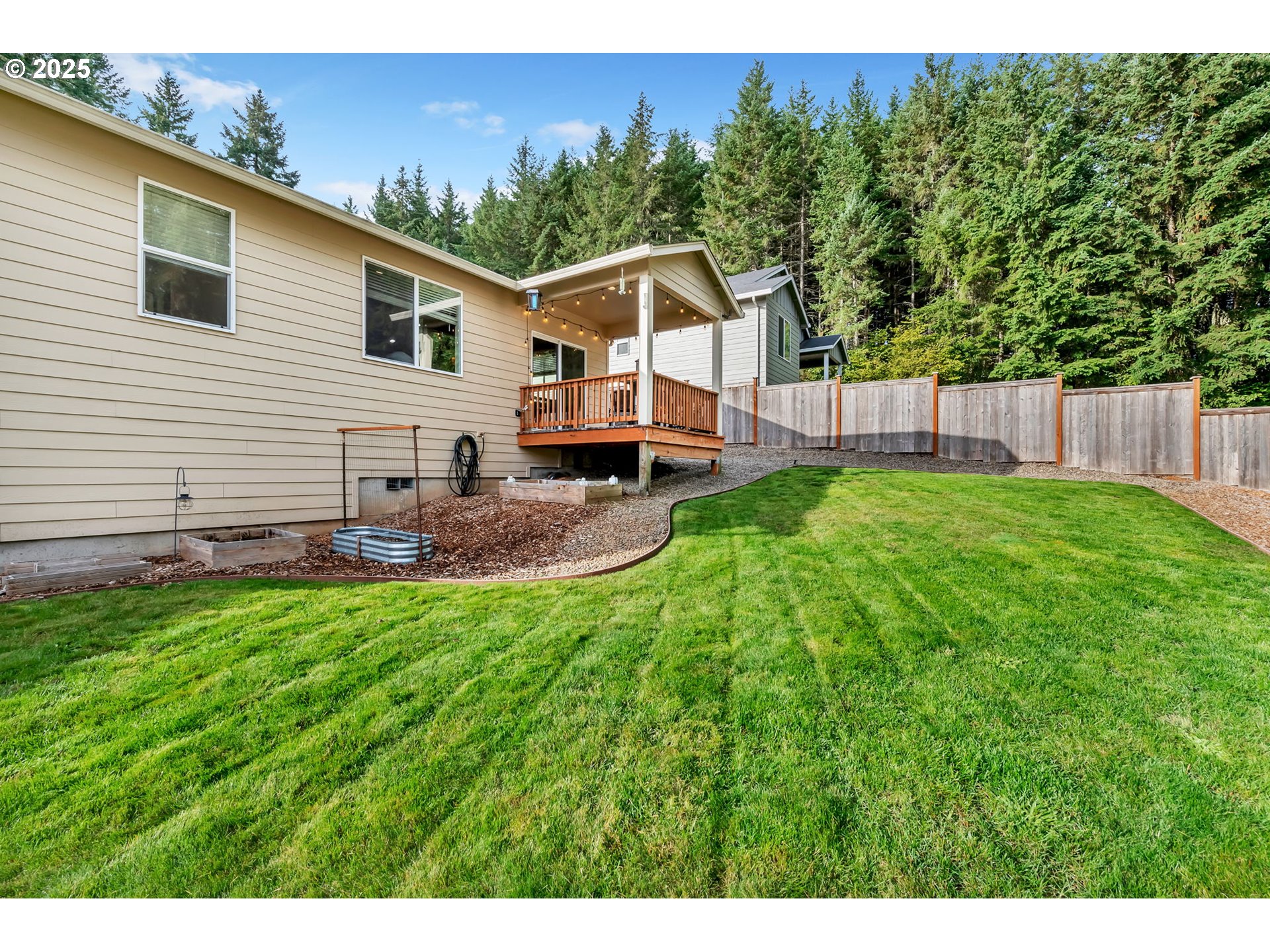24701 Nottingham Street Veneta, OR 97487 - Photo 23 of 28 a house view with a backyard space