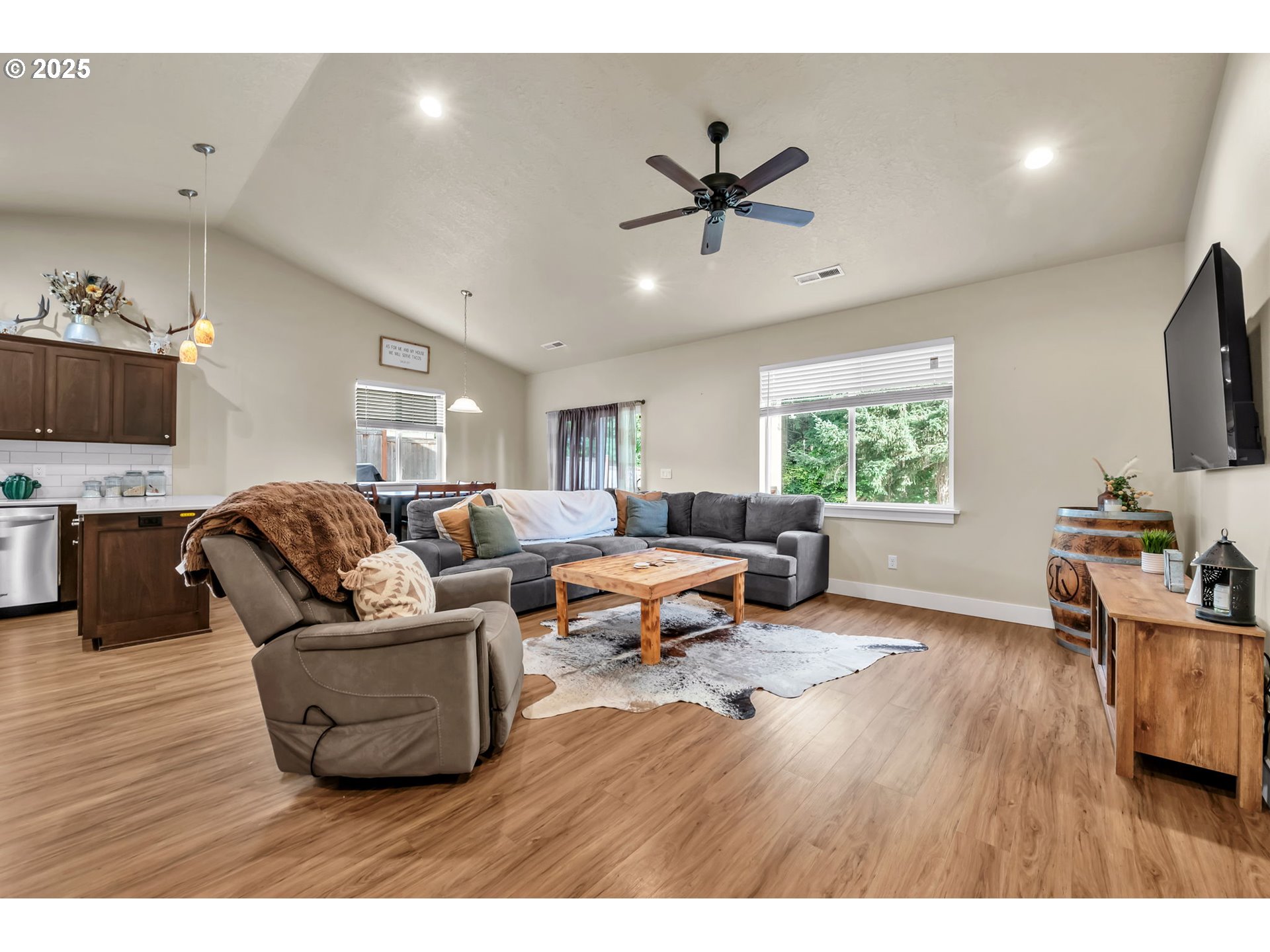 24701 Nottingham Street Veneta, OR 97487 - Photo 3 of 28 a living room with furniture and a flat screen tv