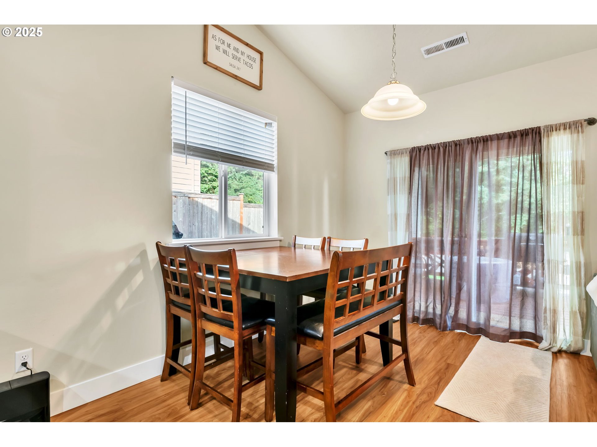 24701 Nottingham Street Veneta, OR 97487 - Photo 9 of 28 a view of a dining room with furniture window and outside view