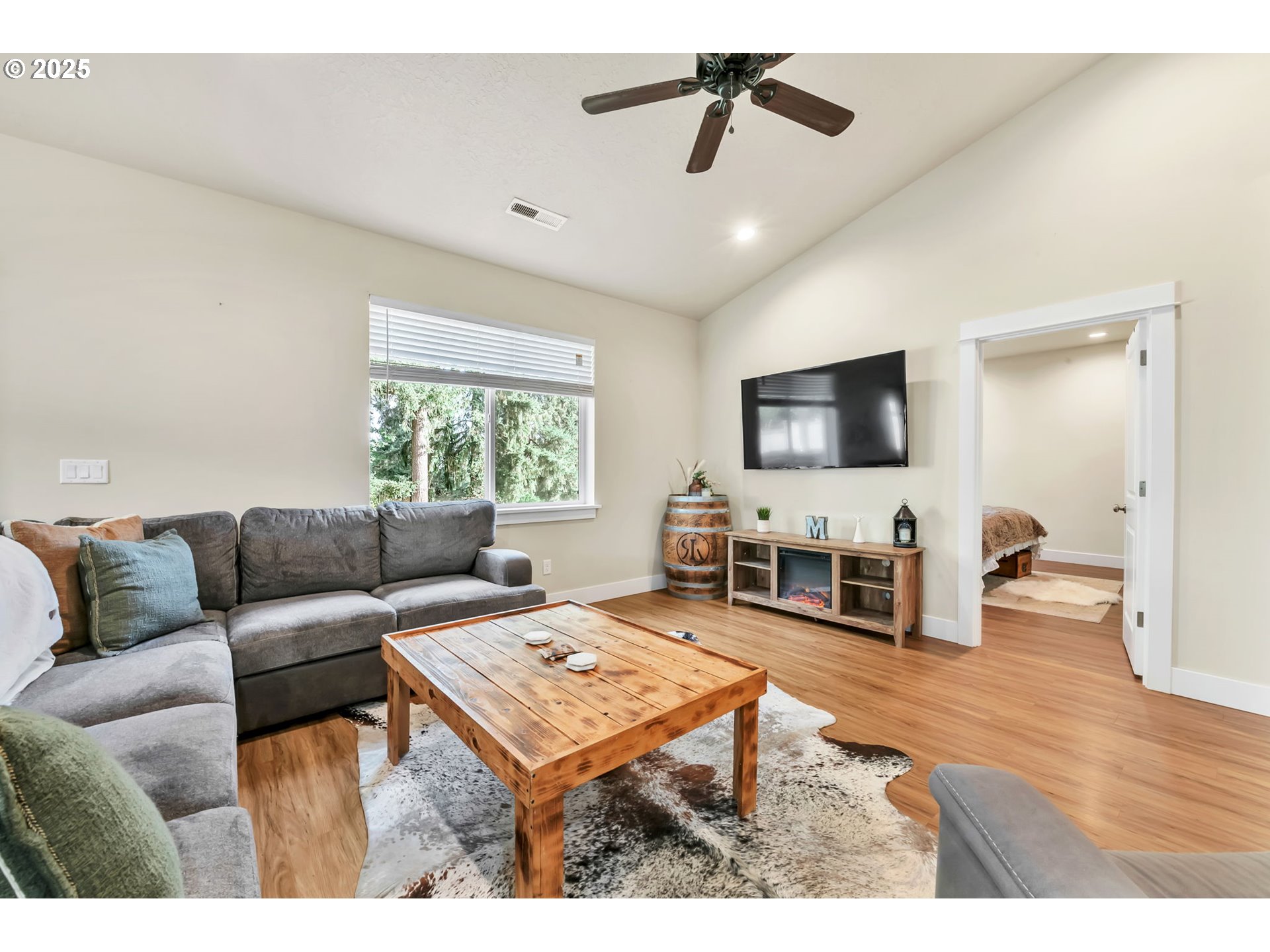 24701 Nottingham Street Veneta, OR 97487 - Photo 10 of 28 a living room with furniture and a flat screen tv
