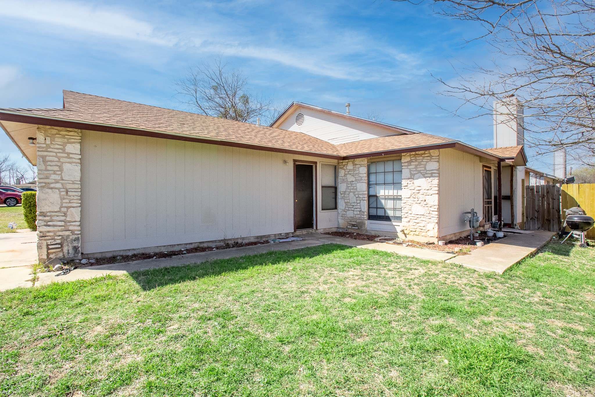 606 Misty Morning Way, Unit A AND B Round Rock, TX 78664 - Photo 5 of 22 Back of house with stone siding and a shingled roof