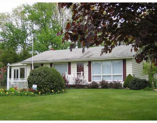 1127 Evans City Road Renfrew, PA 16053 - Photo 1 of 16 Exterior Front. Charming Ranch Home with Great Enclosed Sun Porch. The Yard is Beautifully Landscaped with Flowering Plants and Lovely Shrubs.