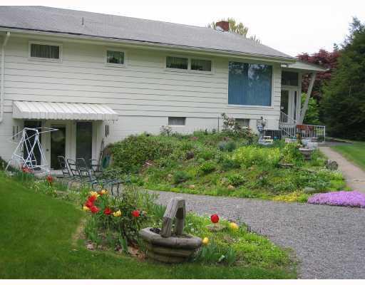 1127 Evans City Road Renfrew, PA 16053 - Photo 2 of 16 Exterior Back. This Home is Very Welcoming, with Fabulous Flower Gardens.
