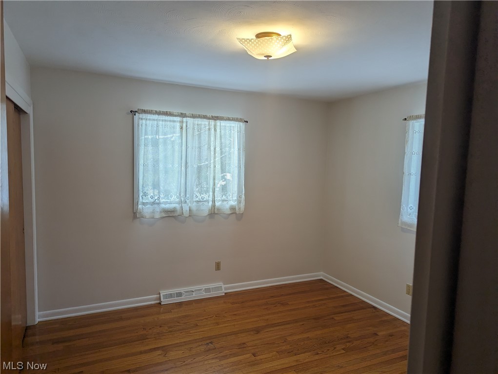 276 Paradise Road Painesville, OH 44077 - Photo 21 of 31 Empty room with dark wood-type flooring