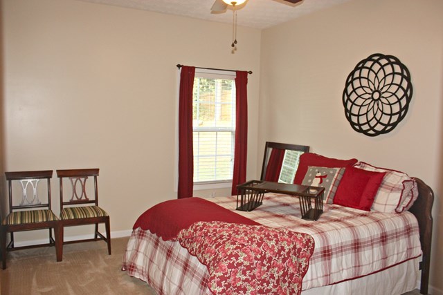 313 Hickory Road Jackson, GA 30233 - Photo 11 of 17 a bedroom with a bed and a window