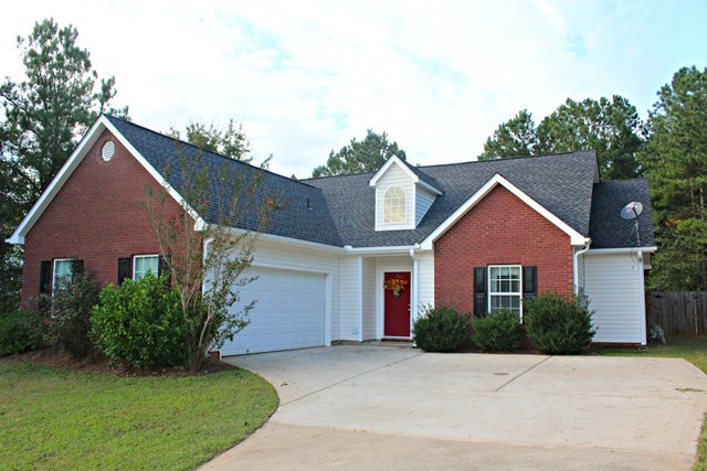 313 Hickory Road Jackson, GA 30233 - Photo 17 of 17 a front view of a house with a garden