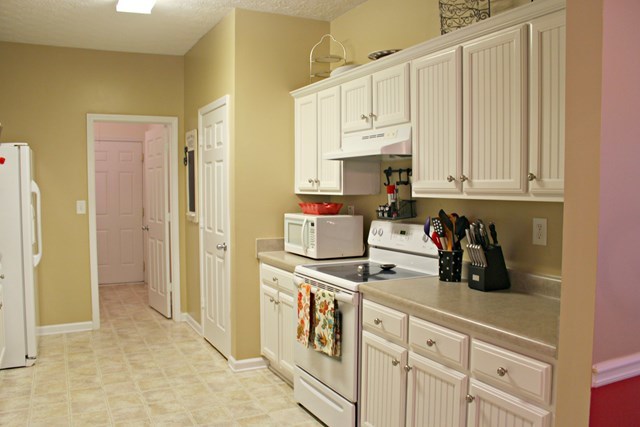 313 Hickory Road Jackson, GA 30233 - Photo 5 of 17 a kitchen with stainless steel appliances granite countertop a stove a sink and a refrigerator