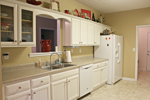 313 Hickory Road Jackson, GA 30233 - Photo 6 of 17 a kitchen with stainless steel appliances a sink a refrigerator and cabinets
