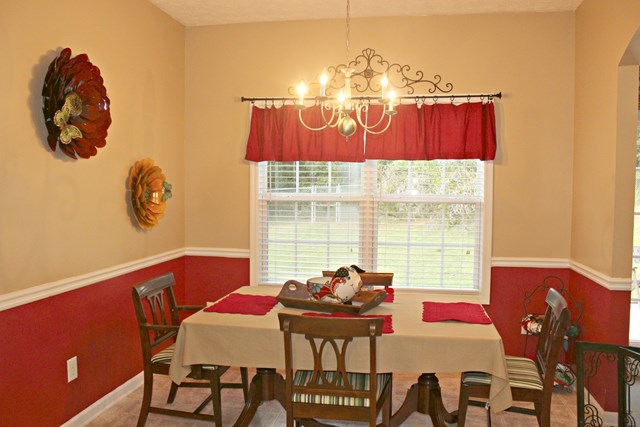 313 Hickory Road Jackson, GA 30233 - Photo 7 of 17 a view of a dining room with furniture and chandelier