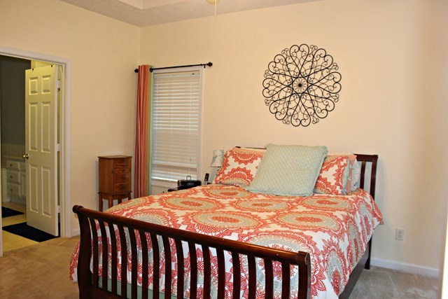313 Hickory Road Jackson, GA 30233 - Photo 8 of 17 a bedroom with a large bed and a window