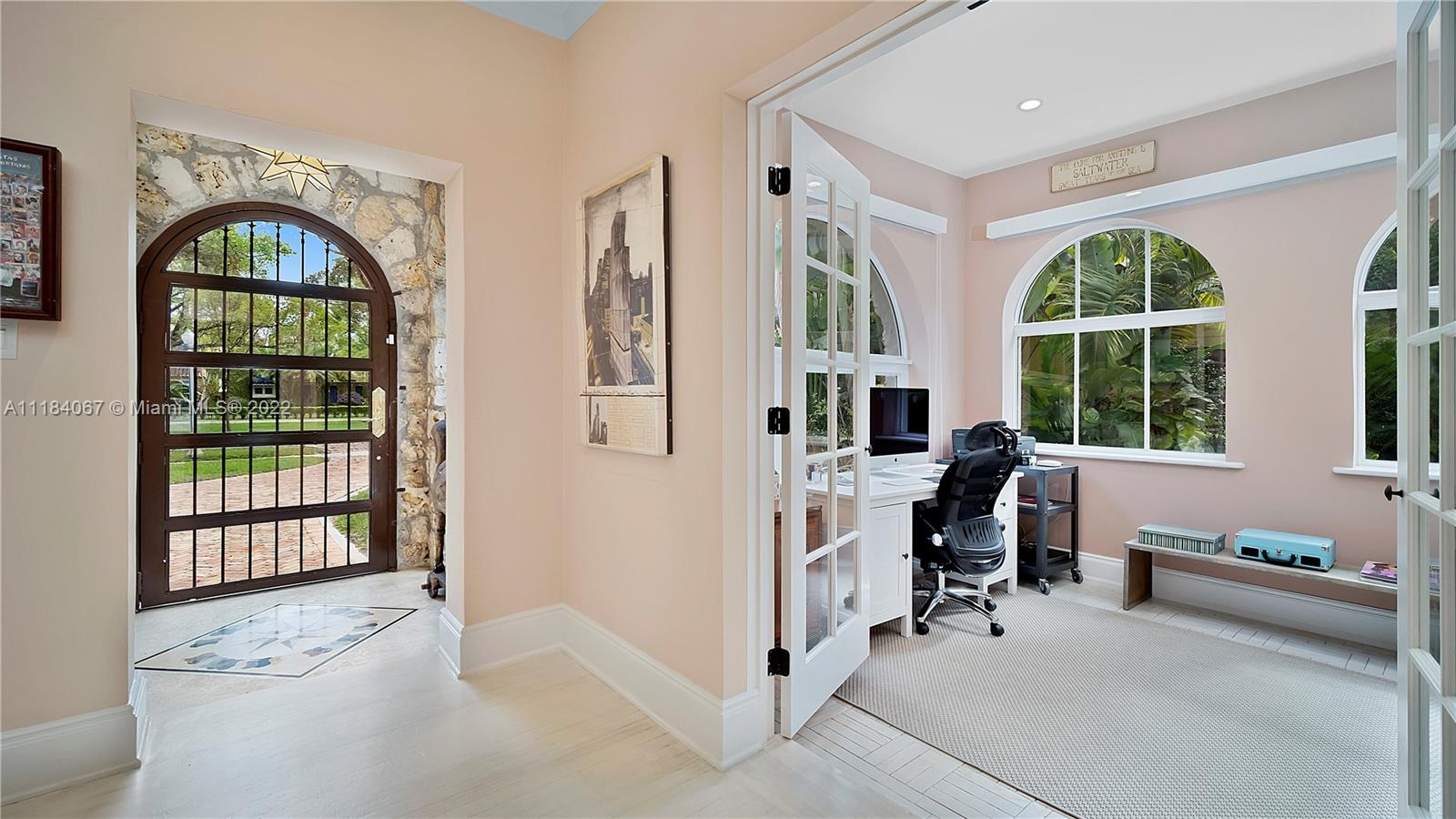 1136 Alhambra Circle Coral Gables, FL 33134 - Photo 21 of 67 a view of hall way with furniture and large windows
