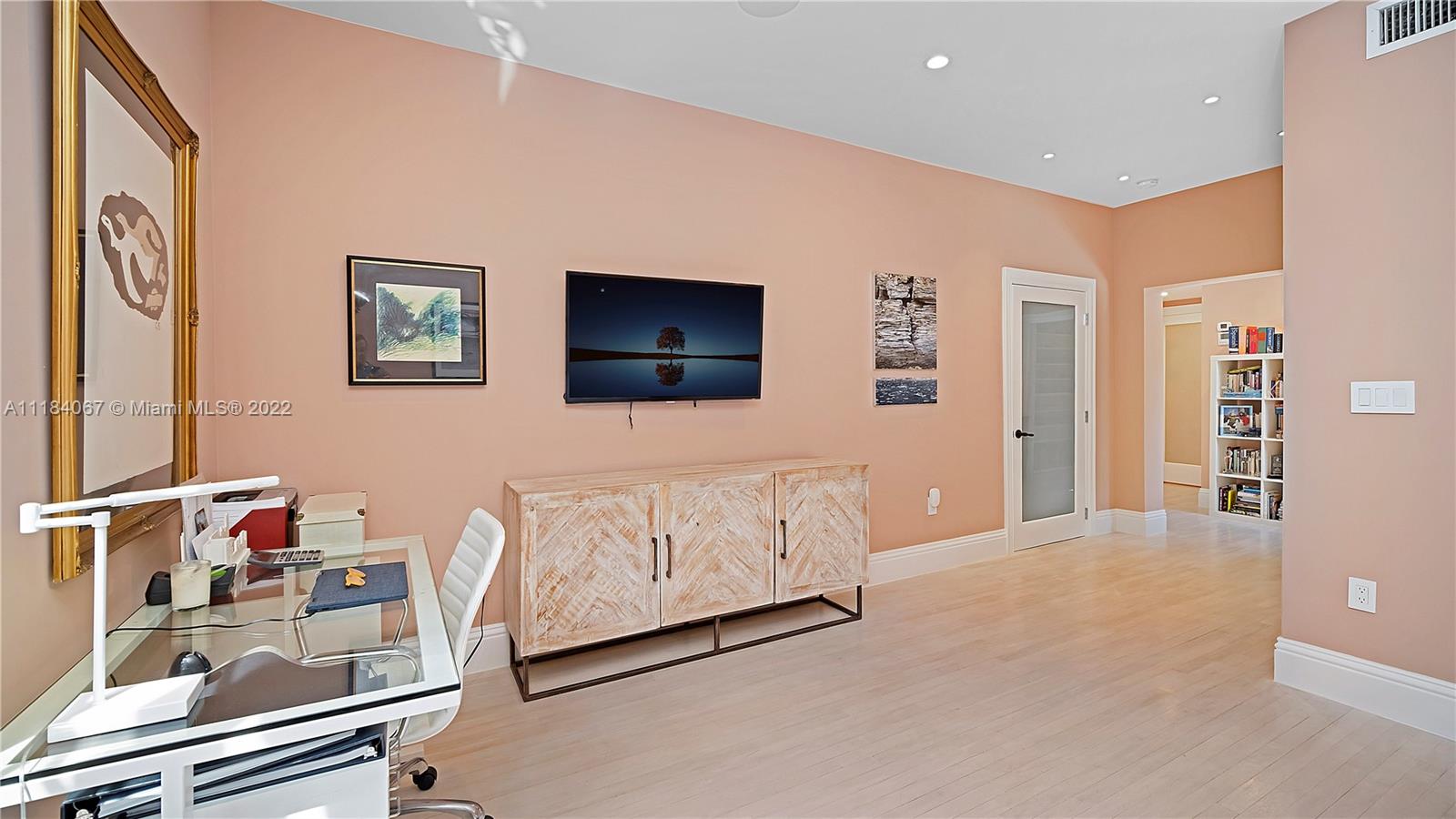 1136 Alhambra Circle Coral Gables, FL 33134 - Photo 31 of 67 a living room with furniture and a flat screen tv