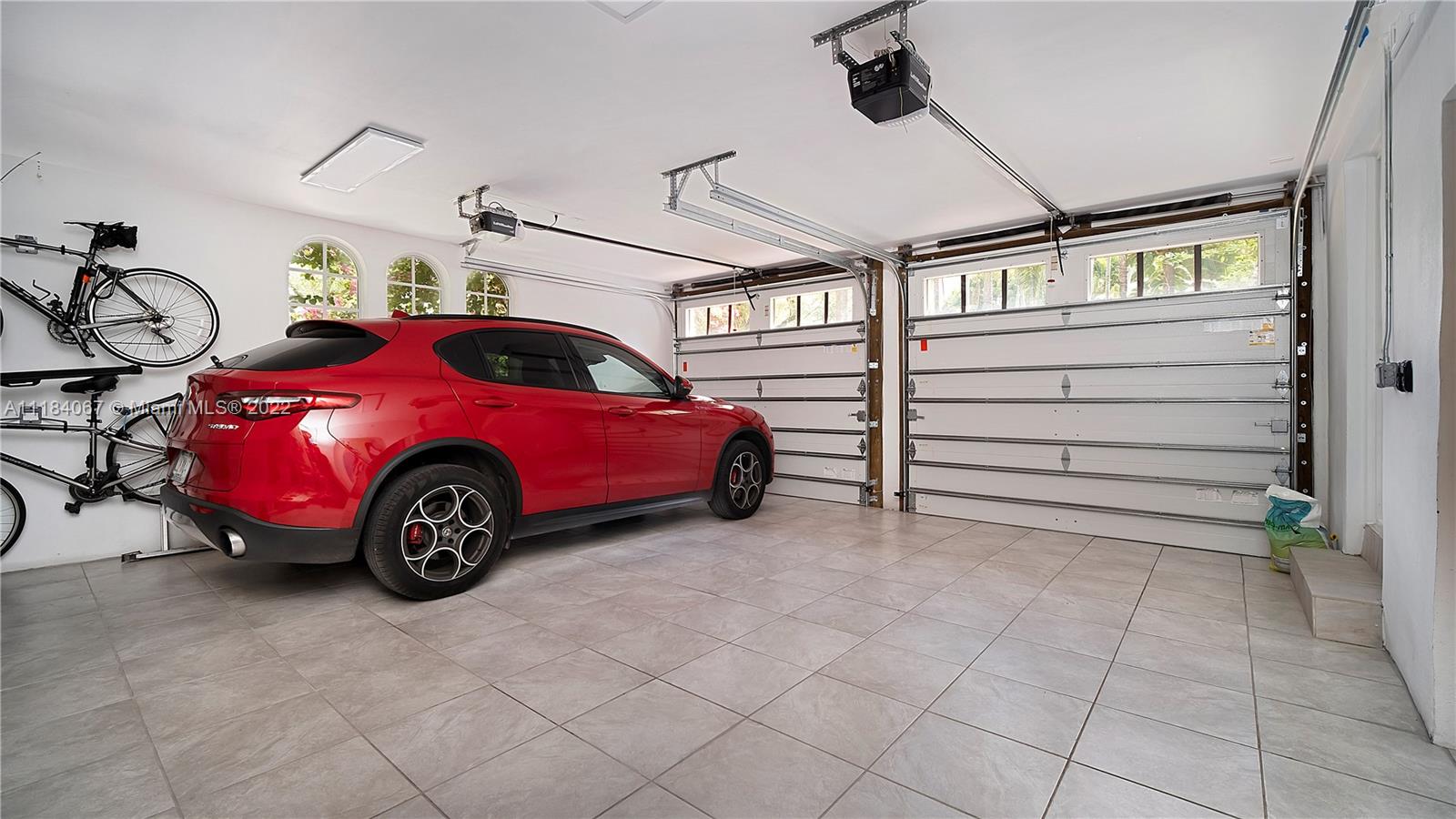 1136 Alhambra Circle Coral Gables, FL 33134 - Photo 54 of 67 a view of a garage and car parked