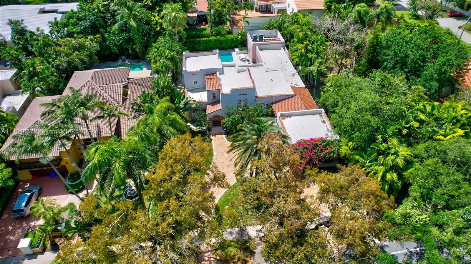 1136 Alhambra Circle Coral Gables, FL 33134 - Photo 65 of 67 an aerial view of residential house with outdoor space and trees all around