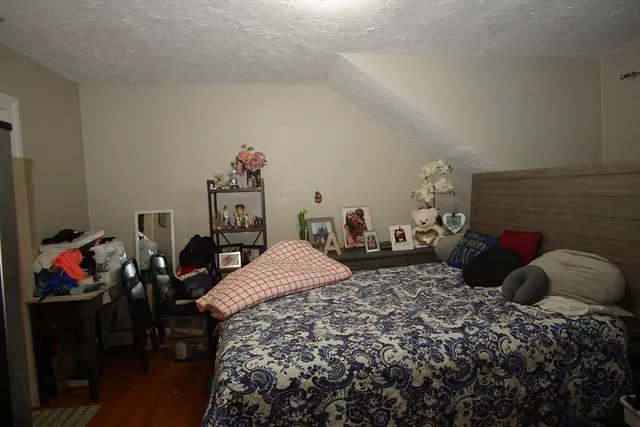 a bedroom with a bed and a closet