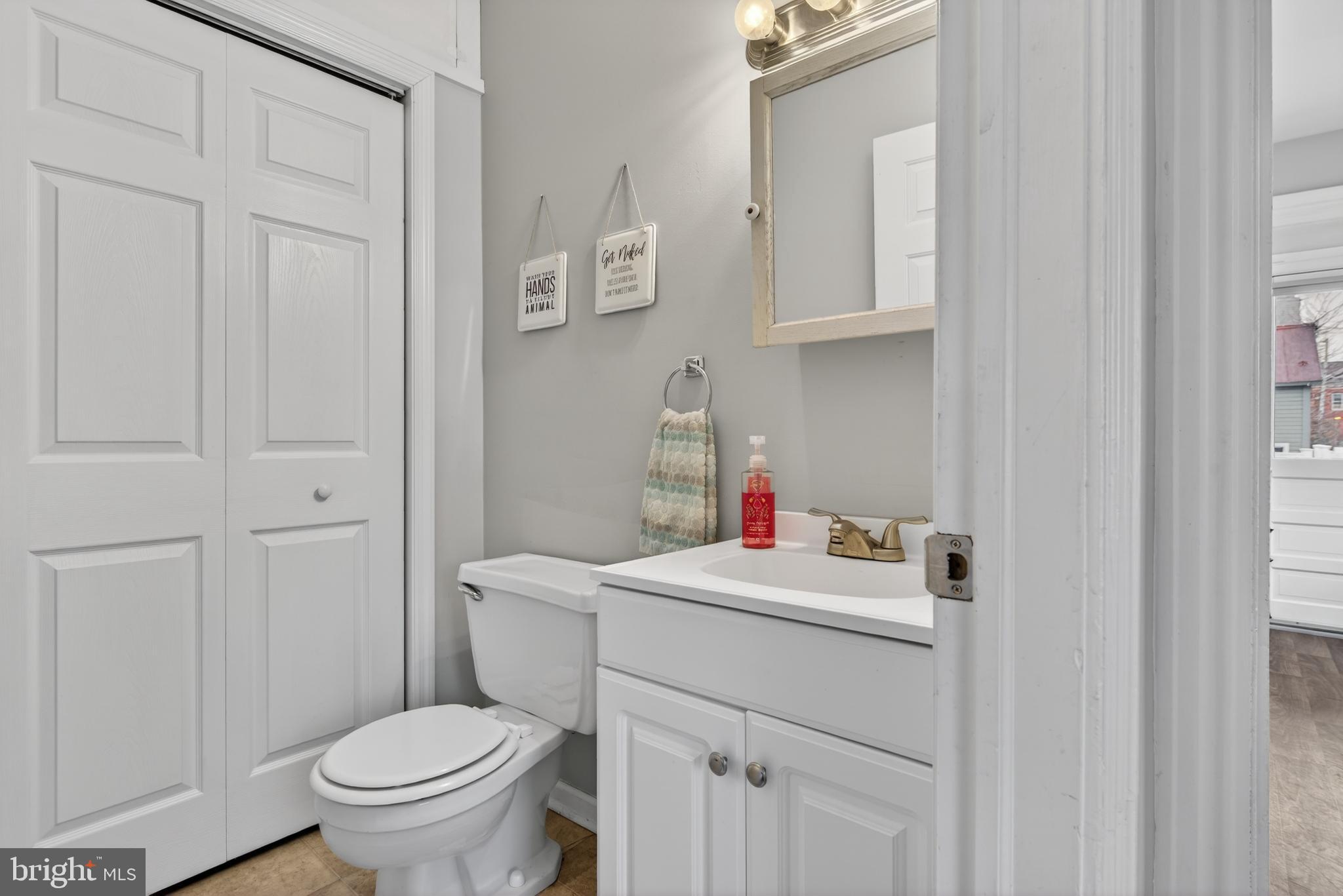 222 North Franklin Street Hanover, PA 17331 - Photo 12 of 29 a bathroom with a sink toilet and a mirror