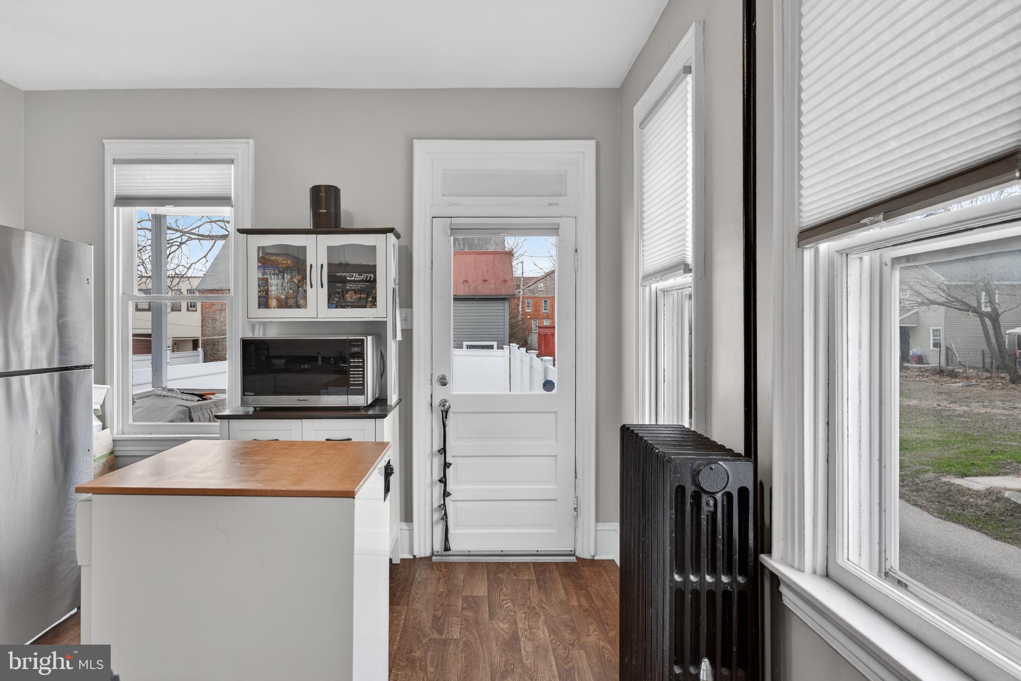 222 North Franklin Street Hanover, PA 17331 - Photo 13 of 29 a kitchen with a refrigerator and a stove top oven