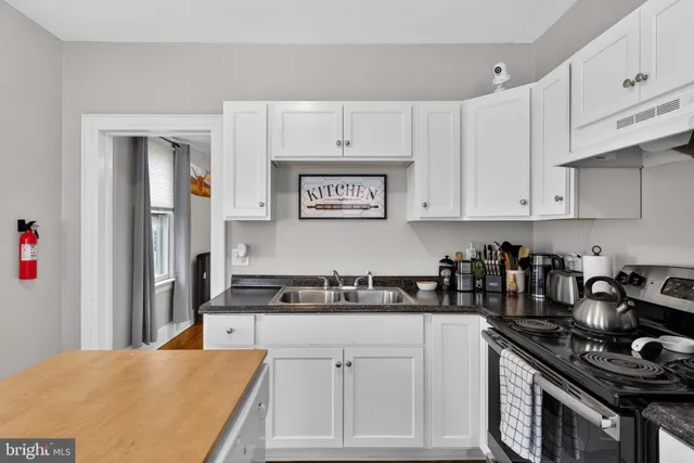 a kitchen with cabinets appliances and a counter space