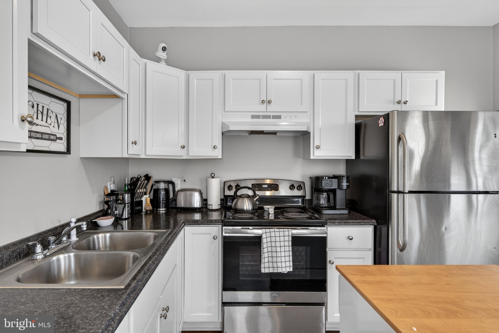 222 North Franklin Street Hanover, PA 17331 - Photo 17 of 29 a kitchen with kitchen island a refrigerator sink and cabinets