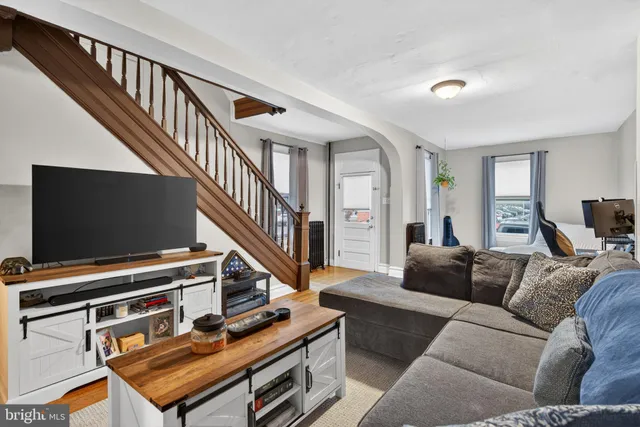 a living room with furniture and a flat screen tv