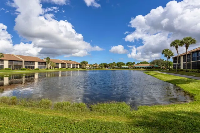 a view of a lake with houses in the background