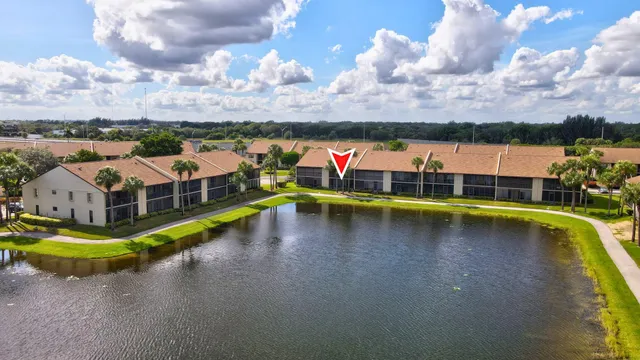 an aerial view of a swimming pool and lake view