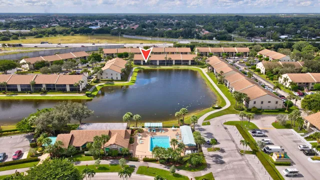 an aerial view of a house with a swimming pool yard and outdoor seating
