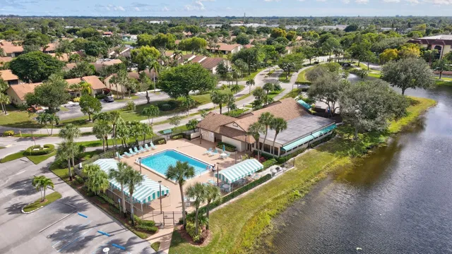an aerial view of a house with a lake view