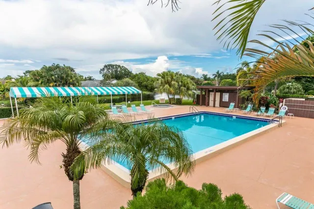 a view of swimming pool with outdoor seating