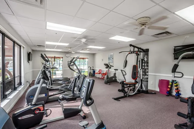 a bed room with a bed and a book shelf