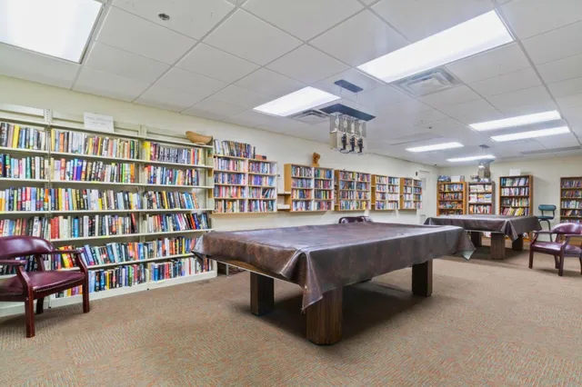 a house with swimming pool in front of it