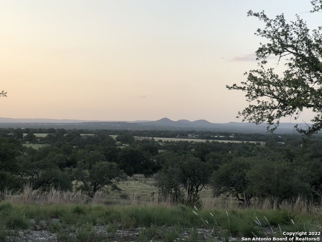 a view of a lake in middle of forest