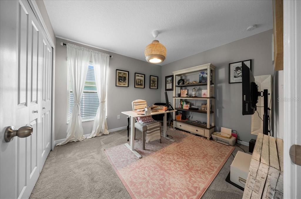 9329 Southwest 57th Terrace Ocala, FL 34476 - Photo 34 of 64 a workspace with furniture and window