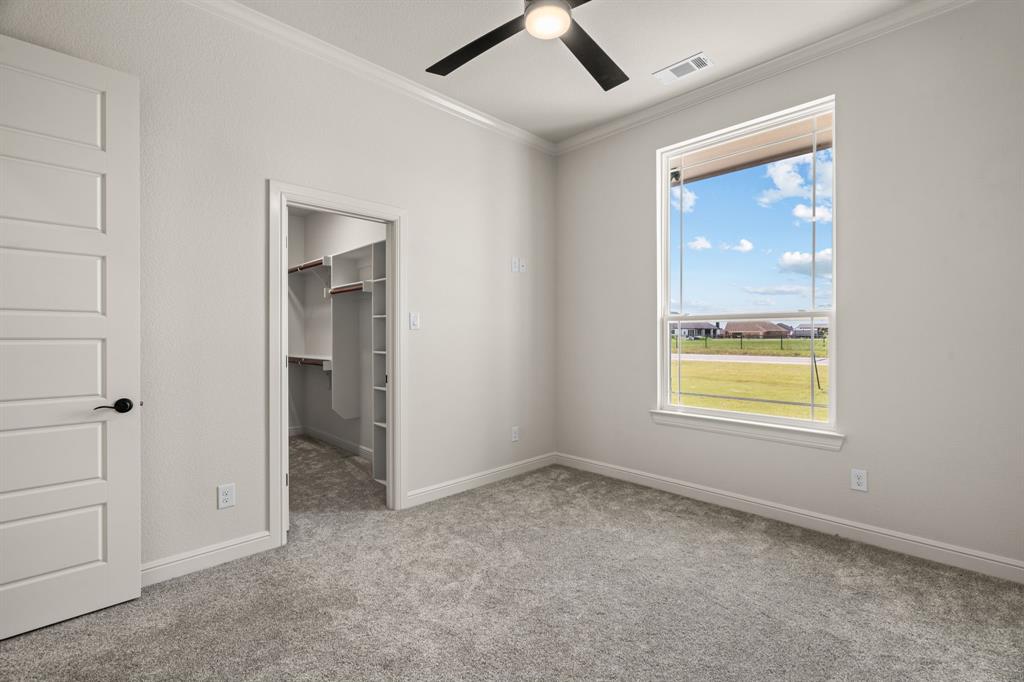 161 Frontera Drive Decatur, TX 76234 - Photo 27 of 39 2nd Guest Bedroom with Carpet, Ceiling Fan & Walk-In Closet