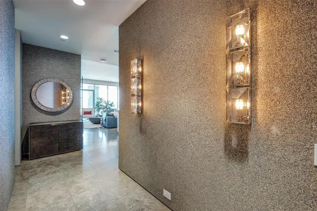 a swimming pool view with a seating space