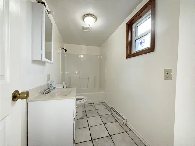 a bathroom with a sink a mirror and shower