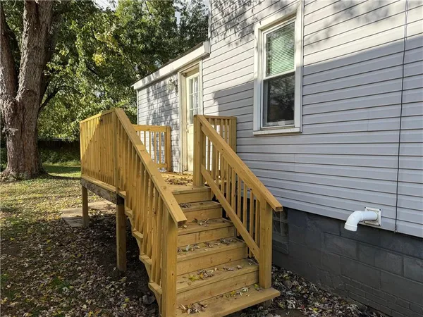 a view of a house with a small yard