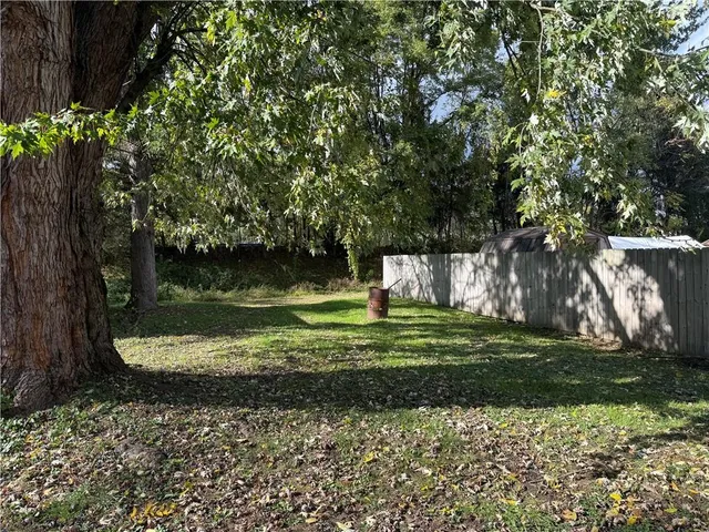 a view of a garden with a bench