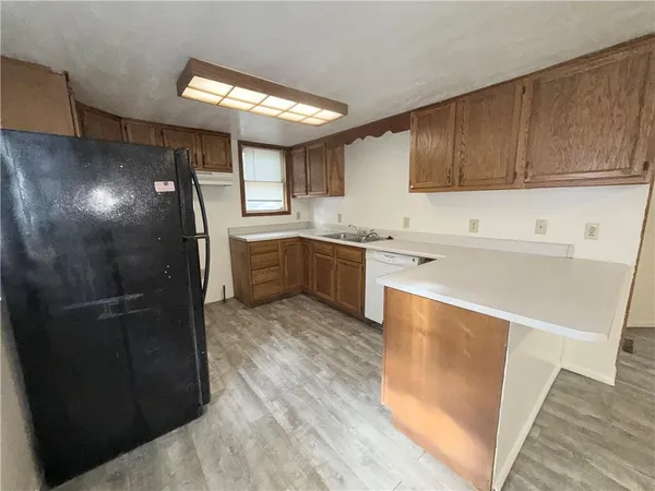 a kitchen with a sink and cabinets