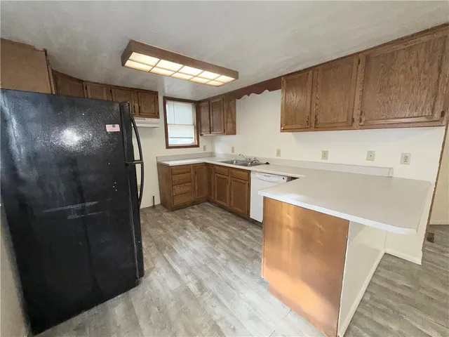 a kitchen with a sink and cabinets