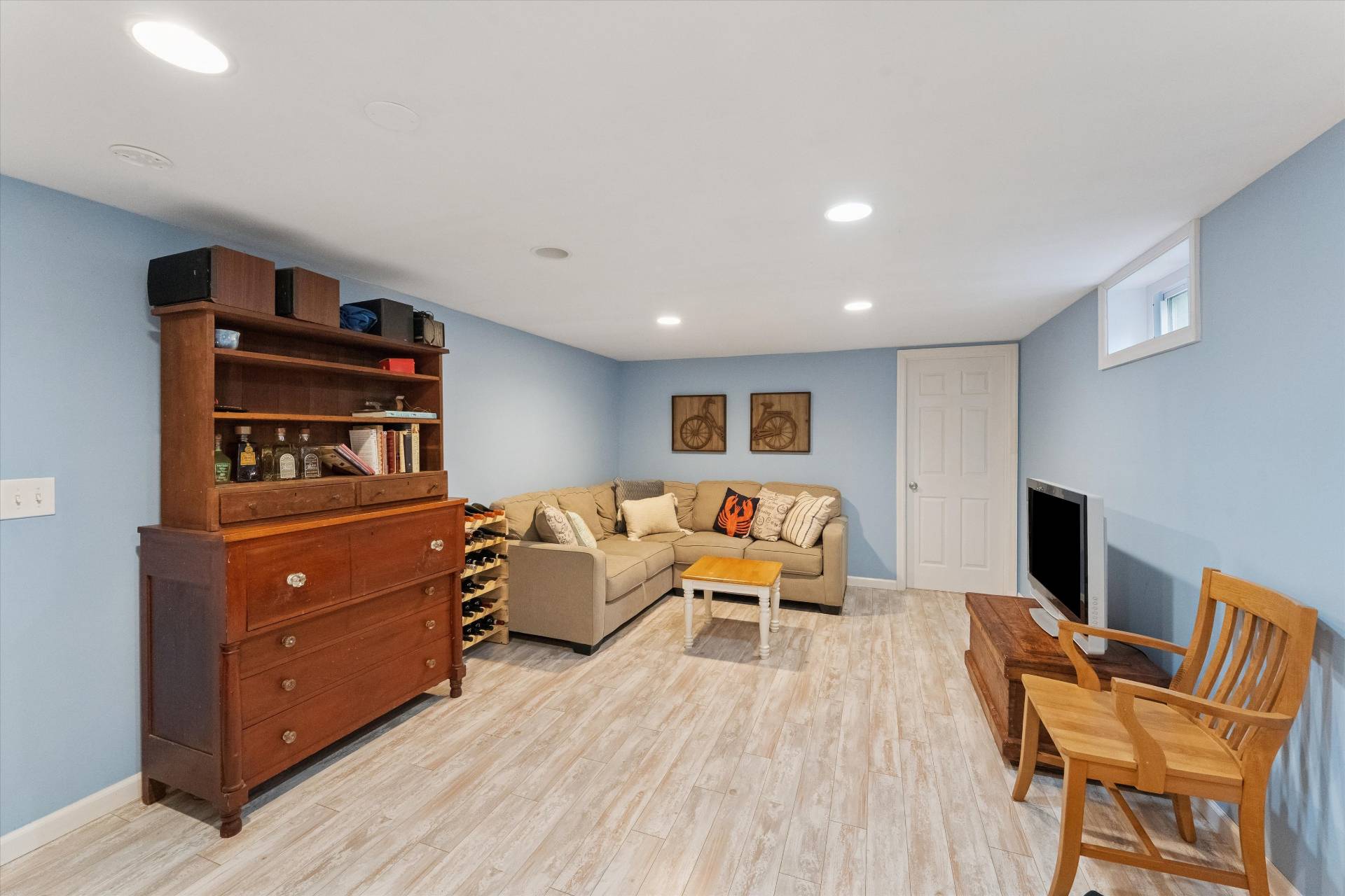 27 South Country Road Westhampton, NY 11977 - Photo 12 of 16 a living room with furniture and a flat screen tv